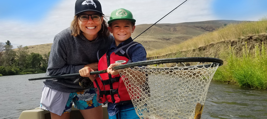 woman and kid fly fishing